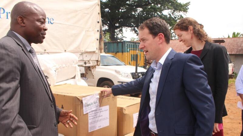 Minister Seán Sherlock and  Irish Ambassador to Sierra Leone, Sineád Walsh meet Gon Myers, World Food Programme, Country Director in Sierra Leone, as 42 tonnes of humanitarian stocks are delivered in Freetown.