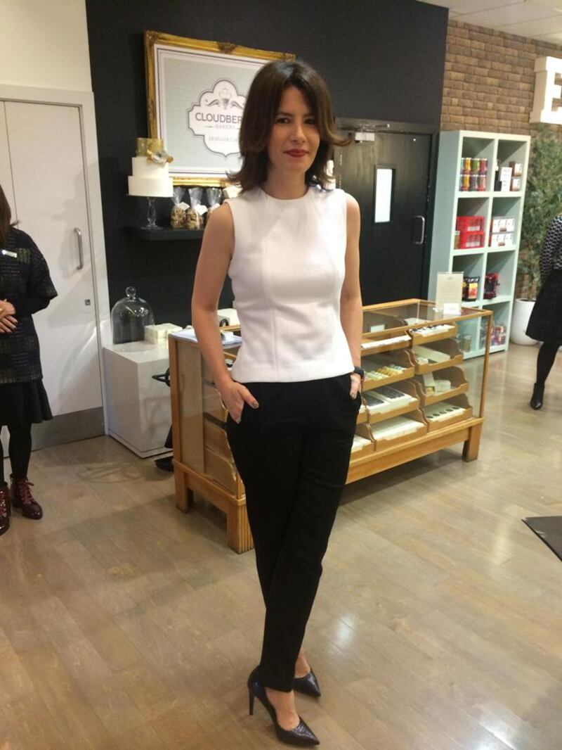 Annmarie O’Connor wears a Victoria Beckham top, Sandro trousers, Vince Camuto shoes and Michael Kors watch