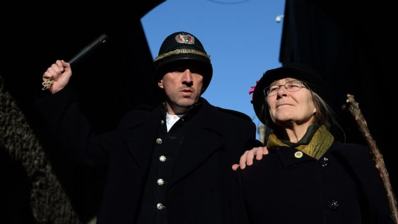 Micheline Sheehy Skeffington, granddaughter of leading Irish suffragette Hanna Sheehy Skeffington, re-enacts smashing the windows in Dublin Castle, pictured being arrested by Rob McCarthy, playing the part of the RIC. Photograph: Dara Mac Dónaill / The Irish Times