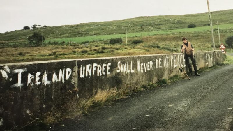 Border country: Ciarán McMenamin  with a catch from the River Derg, on the Tyrone-Donegal border, in 1999