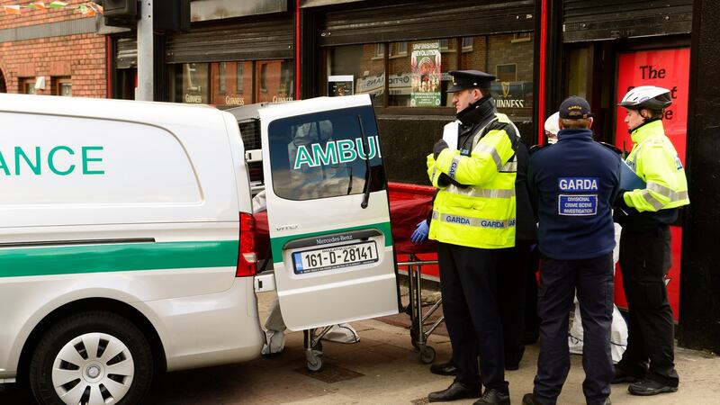 Gardai remove the body of Michael Barr from the scene of the shooting at Sunset House pub, Summerhill, on Tuesday morning. Photograph: Cyril Byrne/The Irish TImes