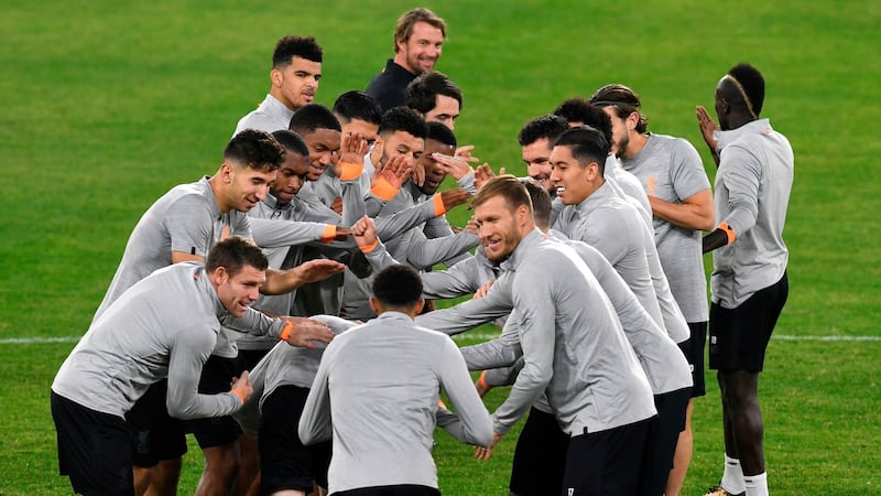 Liverpool’s players take part in a training session at Ramón Sánchez Pizjuán stadium in Seville  on the eve of the UEFA Champions League group E  match between Sevilla and Liverpool. Photograph: Cristina Quicler/AFP/Getty Images