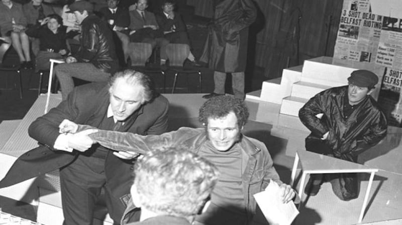 Eamonn McCann being removed from the stage of the Peacock Theatre, Dublin, during a protest in 1970 about the revue, A State of Chassis. Centre stage is actor Martin Dempsey while on McCann’s right is Tomas MacAnna, one of the revue’s authors. Photograph: Tommy Collins/The Irish Times