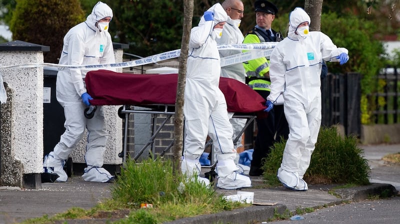 A body is removed from the scene of a shooting at Kilbarron Avenue, Coolock, Dublin. Photograph: Tom Honan for The Irish Times