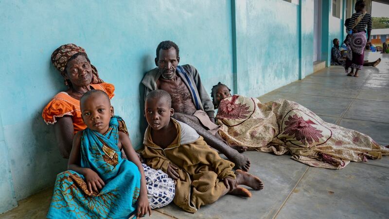 People rest on a porch in a school in Mieze Village, Cabo Delgado, northern Mozambique, on Sunday after the the area was hit by Cyclone Kenneth. Photograph: Antonio Silva/EPA