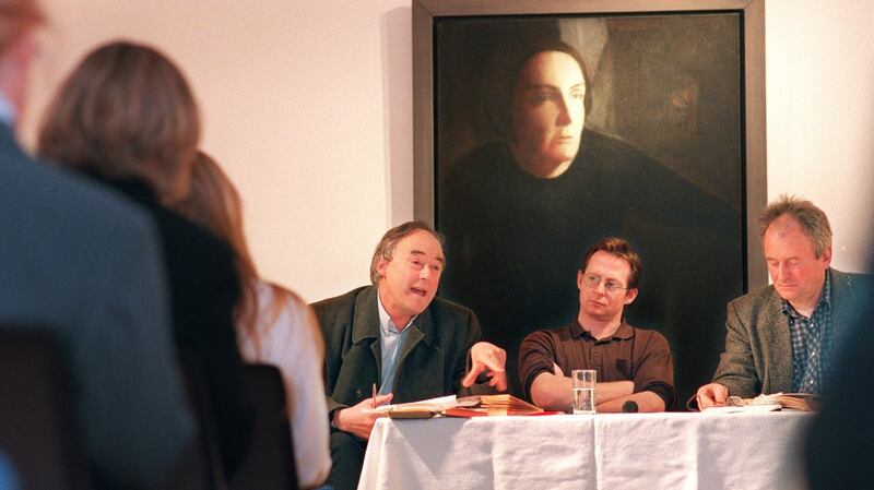 Redmond O’ Hanlon, left, speaks at the Kate O’Brien Weekend in 1999 with James Heaney and  Derek Cahill  in the Hunt Museum, in Limerick, before a portrait of Kate O’Brien. Photograph: Dara Mac Dónaill