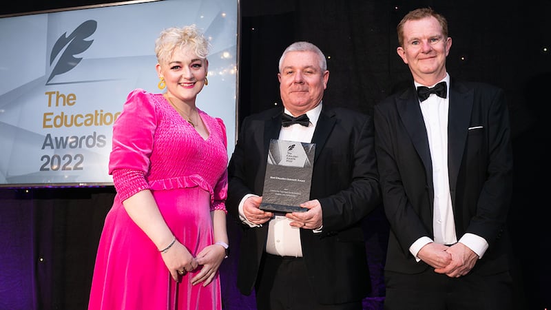 Gerard O'Donovan, Awards Judge, presents the Best Education Outreach Award to Colm O'Reilly, Centre for Talented Youth Ireland, and Dr. Leeanne Hinch, Dublin City University.