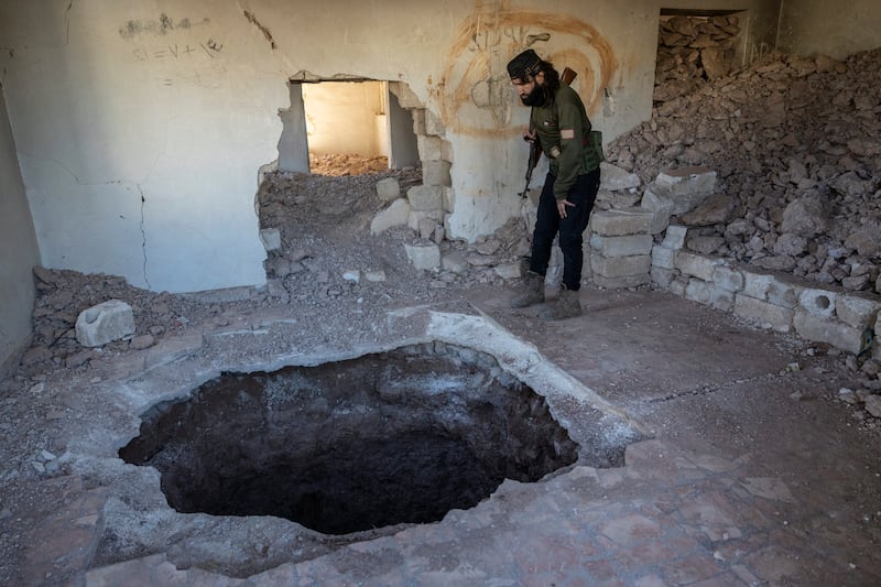  Raed al-Nomor, a member of the Syrian National Army, inspects an underground tunnel in Tel Rifaat, Syria.  Photograph: David Guttenfelder/The New York Times