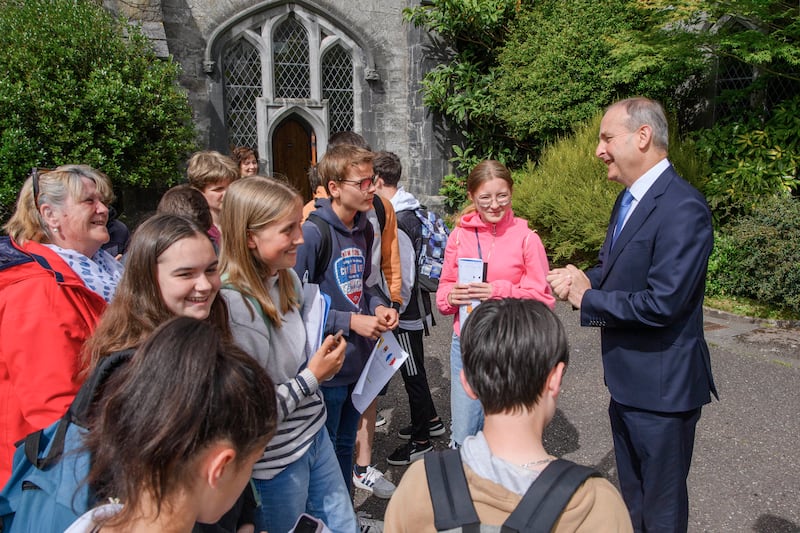 Taoiseach Micheál Martin meets a group of French schoolchildren during a visit to the Irish Civil War National Conference at UCC, Cork on Wednesday.