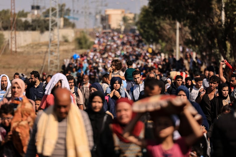 Palestinians fleeing Gaza City and other parts of northern Gaza walking south along a road. Photograph: Mahmud Hams/AFP via Getty