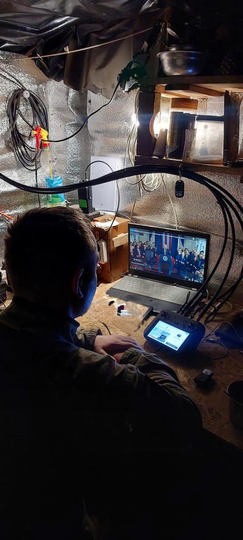 A soldier from the Hellish Hornets watching Donald Trump's inauguration as US president. Photograph: Lt Yulia Mykytenko