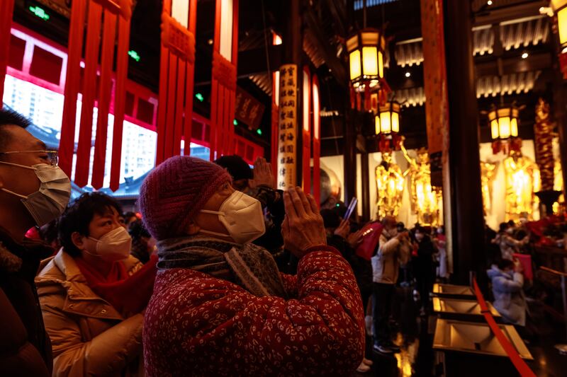 People pray on the first day of the Chinese Lunar New Year in the Jade Buddha Temple, in Shanghai. Photograph: Alex Plavevski/EPA