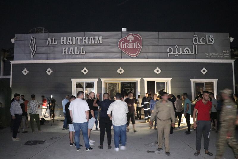 People gather outside a wedding hall in Hamdaniya, in Iraq's Nineveh province, where more than 100 people died in a fire. Photograph: EPA-EFE