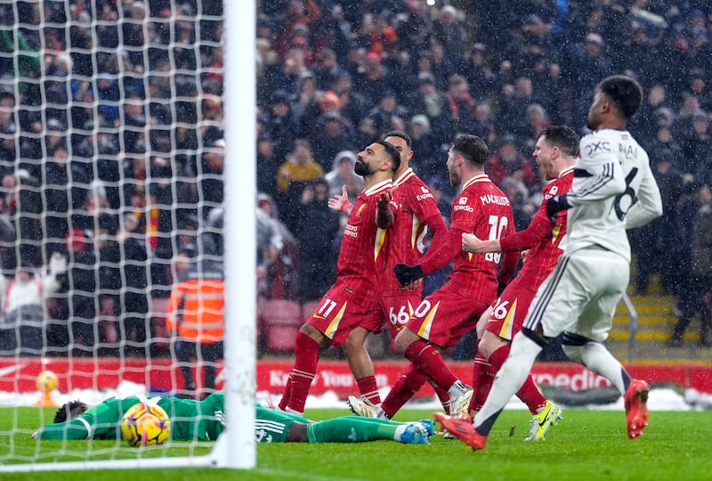 Mohamed Salah celebrates scoring a penalty for Liverpool to put them ahead on 70 minutes. Photograph: Peter Byrne/PA