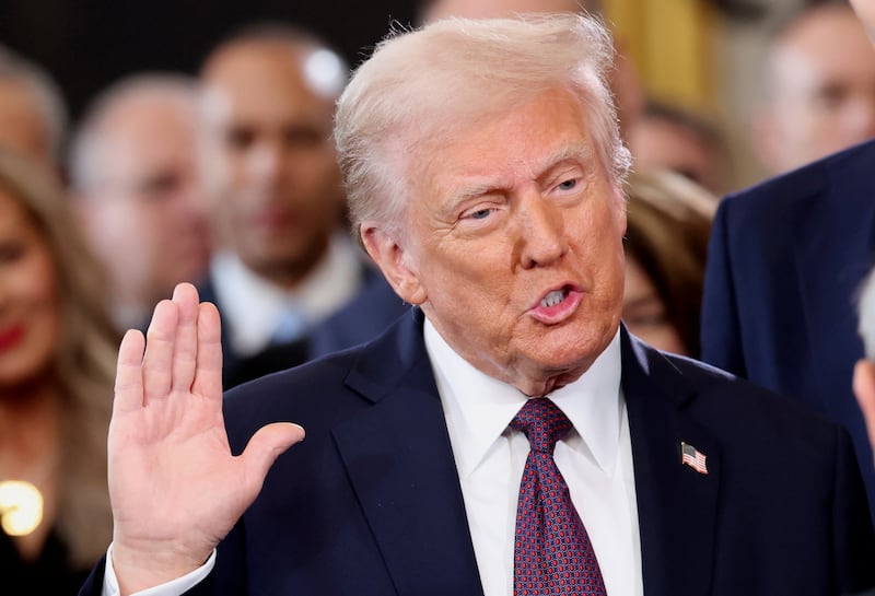 Donald Trump takes the oath of office during his inauguration as US president in the Rotunda of the US Capitol in Washington, DC on Monday. Photograph: Kevin Lamarque/AP