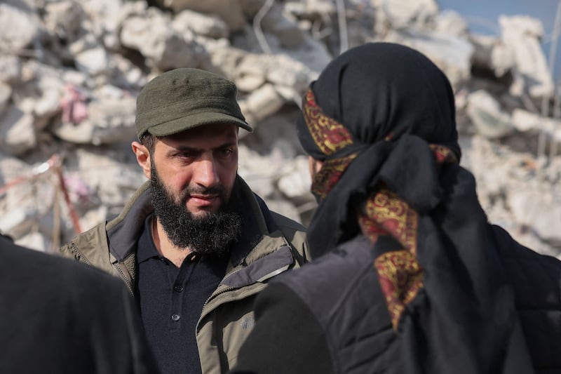 Ahmed al-Sharaa, then known by his nom d guerre Abu Mohamed al-Jolani,  checks the damage following an earthquake in the village of Besnaya in Syria's rebel-held northwestern Idlib province in 2023. Photograph: Omar Haj Kadour/AFP via Getty Images