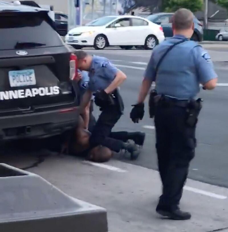 This file still image taken on May 25th shows Minneapolis police officer Derek Chauvin (centre) arresting George Floyd. Photograph: Darnella Frazier/Facebook/AFP via Getty