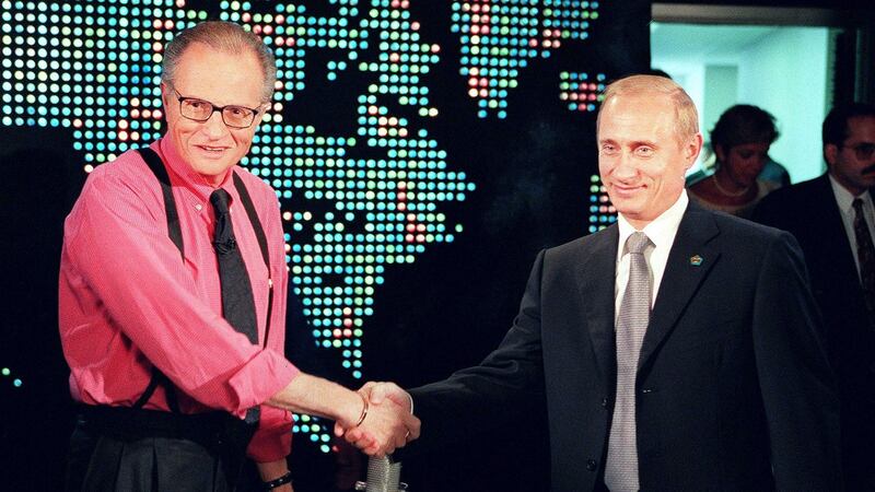 Russian president Vladimir Putin (R) shakes hands with CNN interviewer Larry King before the start his interview in New York in 2000. Photograph: Joshua Roberts/Getty Images