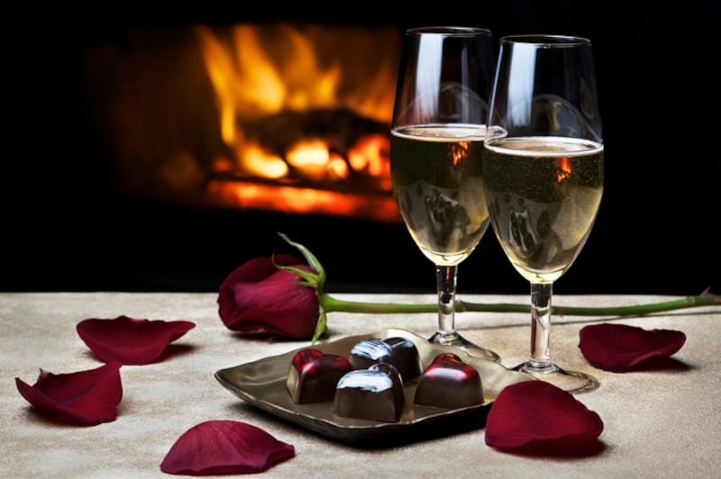 A romantic meal for two at home might be more enjoyable than dining in a packed restaurant. Photograph: Getty