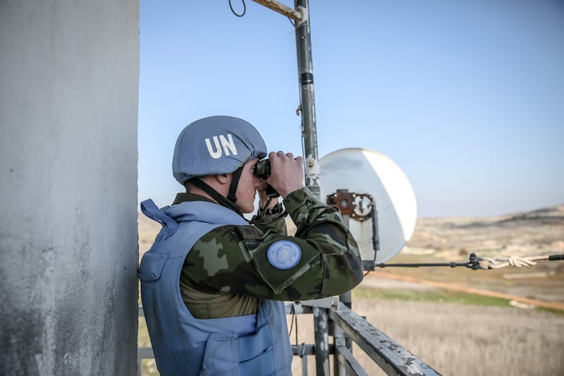 A peacekeeper looks out from Unifil Outpost 6-52, right beside the Israel-Lebanon border. Photograph: Sally Hayden