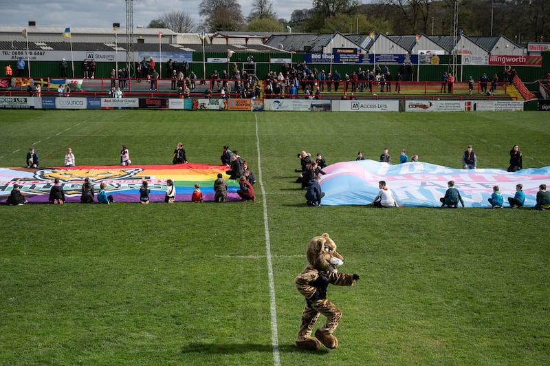 The Keighley Cougars mascot dances before the match. Photograph: Mary Turner/The New York Times
                      