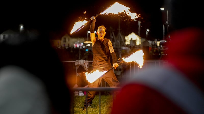 Street performances take place during the NYF Dublin fireworks in Howth harbour. Photograph: Allen Kiely