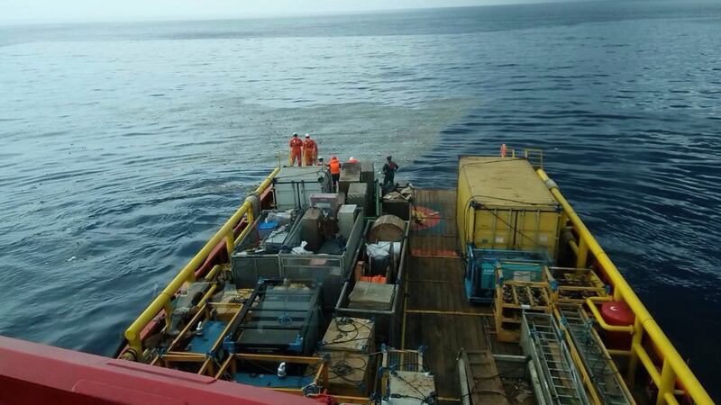 Rescuers inspect oi slick debris believed to be from Lion Air passenger jet that crashed off West Java on Monday. Photograph: BNPB via AP