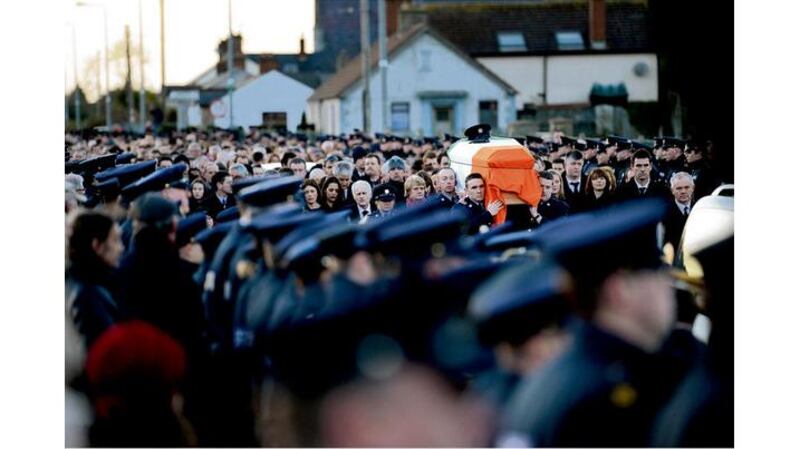 Public outpouring: the State funeral of Det Garda Adrian Donohoe this week. photographs: dara mac dónaill, peter muhly/afp/getty