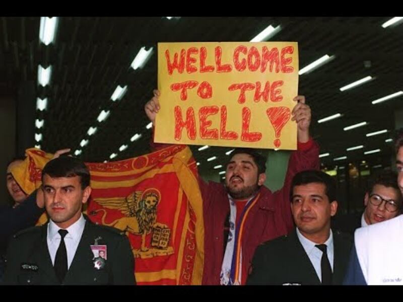 A Galatasaray supporter greets the arriving Manchester United team in Istanbul in 1993