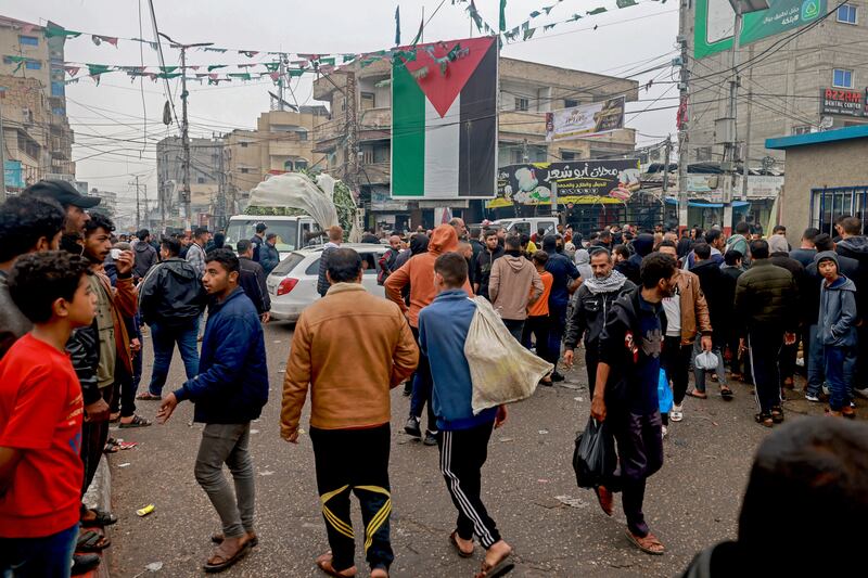 Palestinians, including many displaced from other areas in the Gaza Strip, walk through a square in Rafah near the border with Egypt on December 5th. Photograph: Mohammed Abed/AFP via Getty