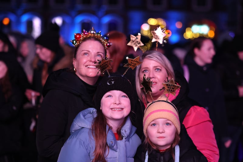 Grace Berkery and Gladys Adams with parents Martina Berkery and Niamh Adams joined other families and friends at Dublin Castle on New Year’s Eve as part of the New Year Festival. Photograph: Dara Mac Dónaill








