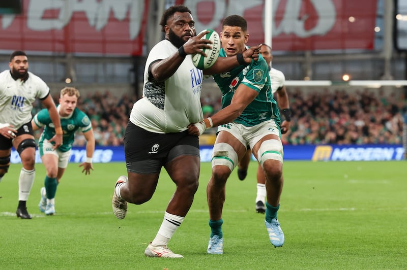 Fiji's Luke Tagi is caught by Ireland's Cormac Izuchukwu. Photograph: Dan Sheridan/Inpho