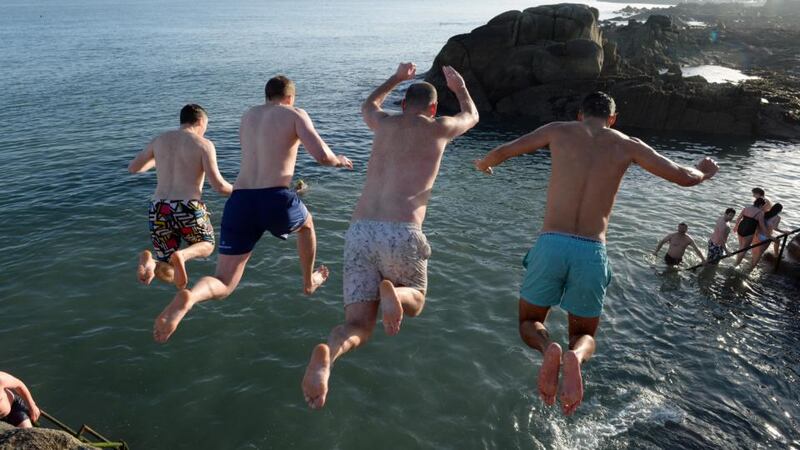 Taking the plunge: Christmas swimmers at the Forty Foot in Sandycove, Dublin yesterday morning. Photograph: Frank Miller/The Irish Times