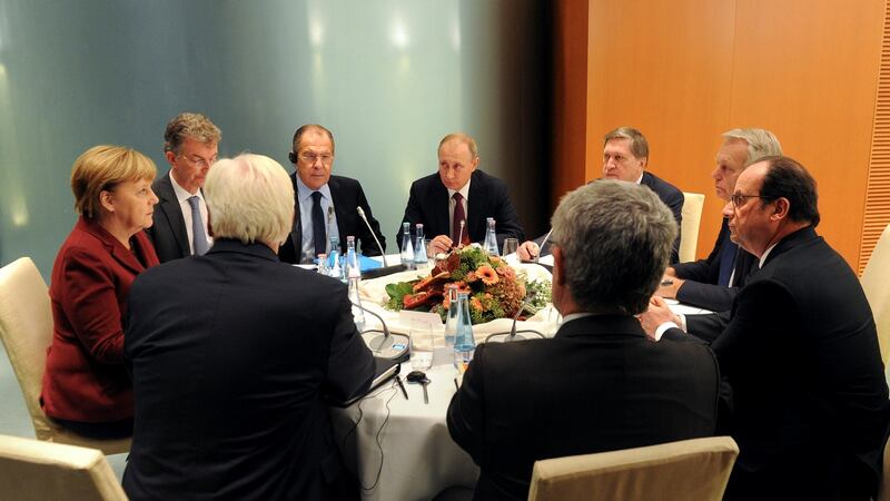 Russian President Vladimir Putin, Russian Foreign Minister Sergei Lavrov, Kremlin aide Yuri Ushakov, German Chancellor Angela Merkel, German Foreign Minister Frank-Walter Steinmeier, French President Francois Hollande and French Foreign Minister Jean-Marc Ayrault attend a meeting on the situation in Syria at the chancellery in Berlin, Germany, October 20th, 2016. Photograph: Mikhail Klimentyev/Reuters