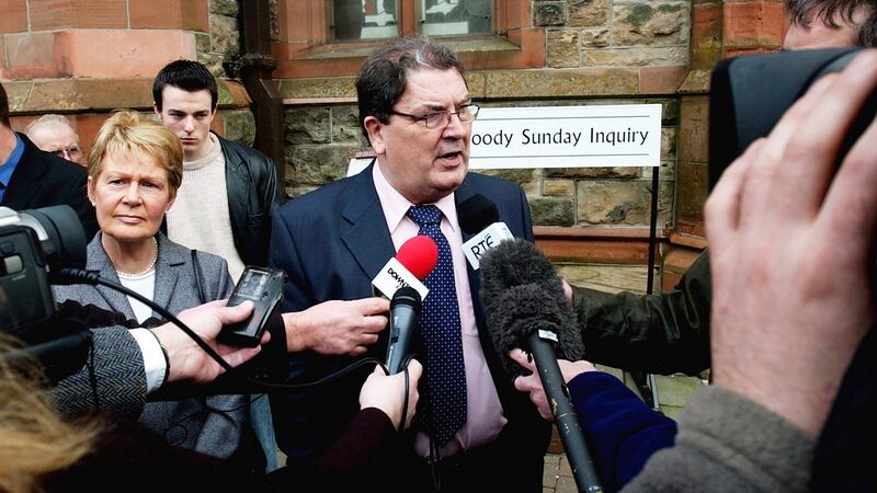 Pat Hume, with her husband John, speaking after giving evidence at the Bloody Sunday Inquiry in Derry, 2002