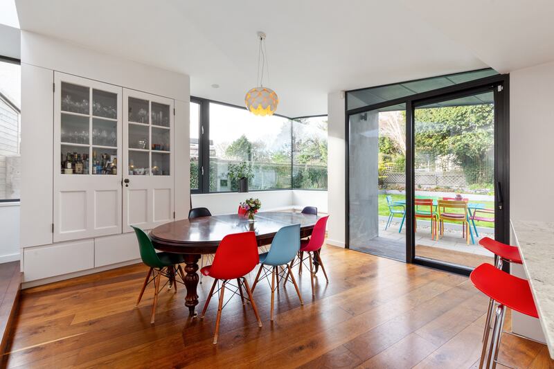 Dining area with built in bench and doors to garden