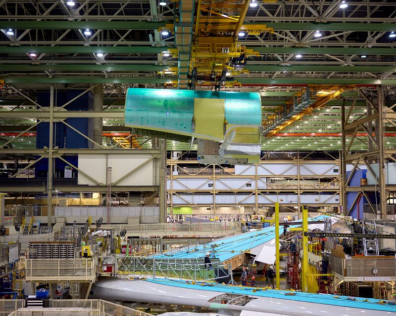 A custom crane moving the fuselage, which will then be lowered on to the body of the plane. Photograph: Meron Tekie Menghistab/The New York Times