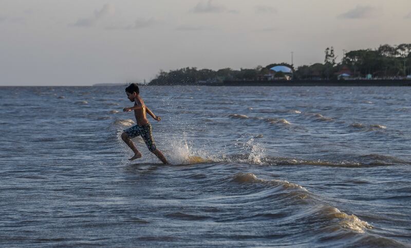 A boy plays in the Amazon river in Macapa, Amapa state. Photograph: Apu Gomes/AFP via Getty Images