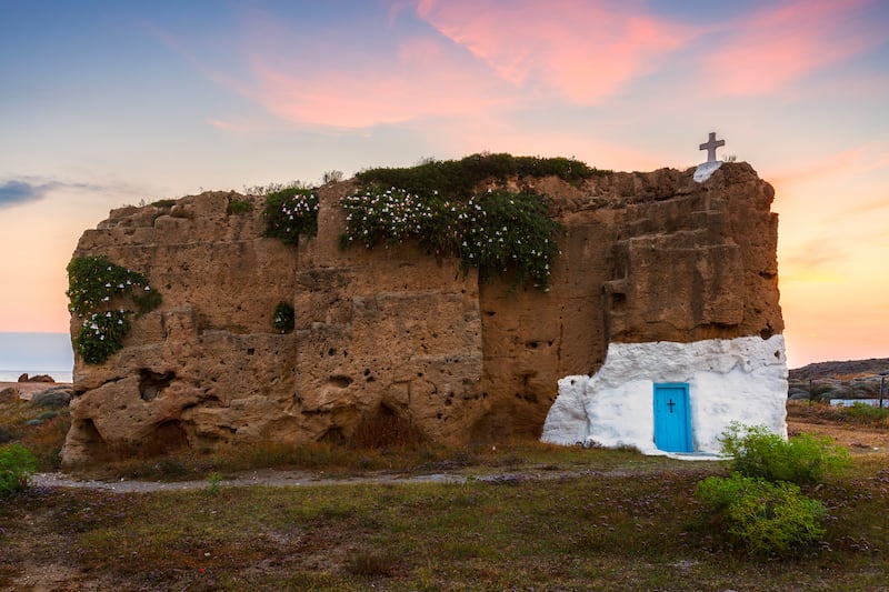 Small church carved into a rock in historical limestone quarry near Molos village on Skyros island, Greece.