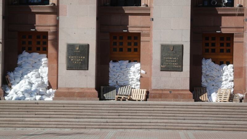 Sand bags and pallets outside Kyiv city hall. Photograph: Zurab Kurtsikidze/EPA