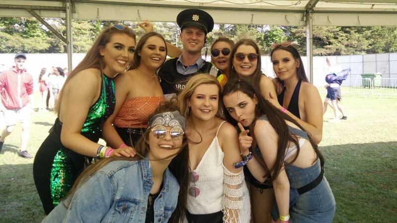 A garda finds himself at the centre of a crowd at Longitude 2017. Photograph: Garda/Twitter