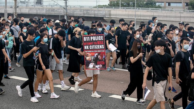 Demonstrators and travellers leave Hong Kong International Airport along a road towards Tung Chung in Hong Kong, China, on Monday, August 12th, 2019. Photographer: Kyle Lam/Bloomberg