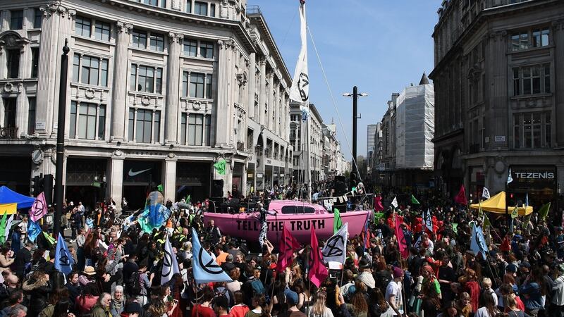 Environmental protesters  gather at the junction of Oxford Street and Regent Street in London on Monday. Photograph: Daniel Leal-Olivas/AFP/Getty Images