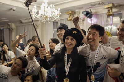 Runners celebrate after the Baikal Ice Marathon in Listvyanka, Russia.