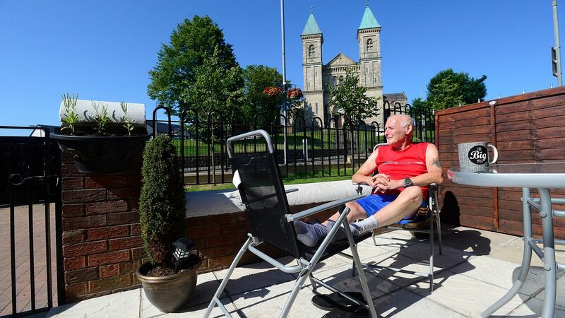 Paddy Copeland outside his Ardoyne home on the Crumlin Road across from the Holy Cross Church in Belfast. Photograph: Arthur Allison/Pacemaker Press