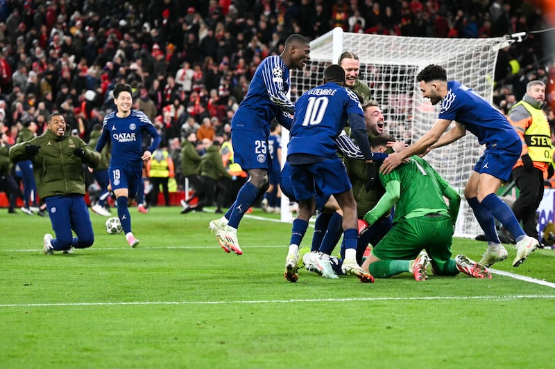 Paris Saint-Germain's players celebrate at the end of the penalty shoot-out. Photograph: Oli Scarff/AFP via Getty Images          