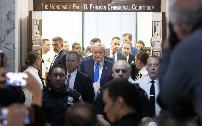 Former US President Donald Trump walks out of the courtroom after attending the first day of his civil fraud trial in New York. Photograph: Justin Lane/EPA