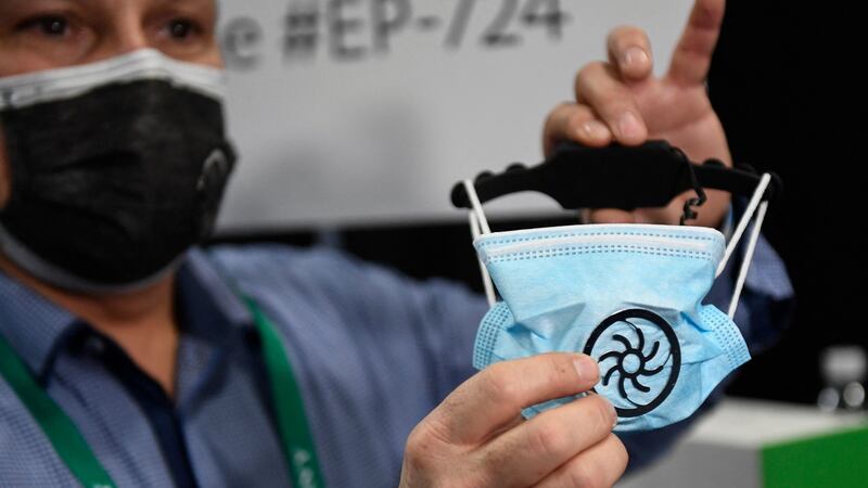 Eric Fouchard, president of NewPadMaker, demonstrates the aeronest mask ventilation kit during CES Unveiled ahead of the Consumer Electronics Show (CES) in Las Vegas, Nevada. Photograph:  Patrick Fallon / AFP via Getty Images