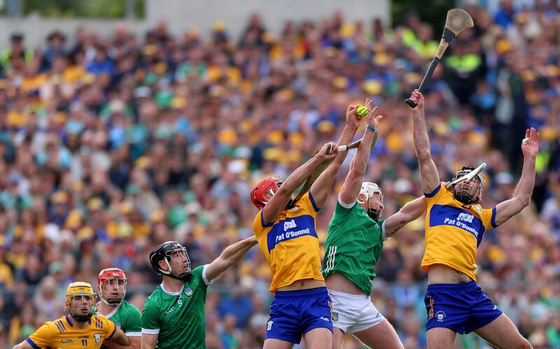 Limerick’s Diarmaid Byrnes and Cian Lynch with Peter Duggan and Cathal Malone of Clare. Photograph: James Crombie/Inpho