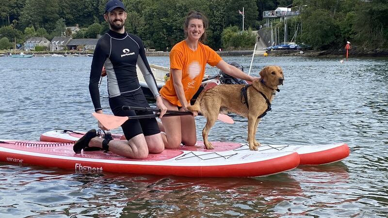 Conor Lane and Helena McNish paddleboarding in Cornwall.